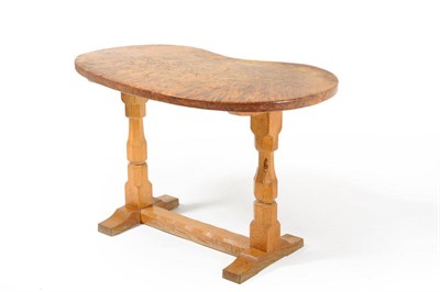 Lot 1747 - A Robert "Mouseman" Thompson Burr Oak Kidney Table, on two octagonal legs joined by a stretcher...