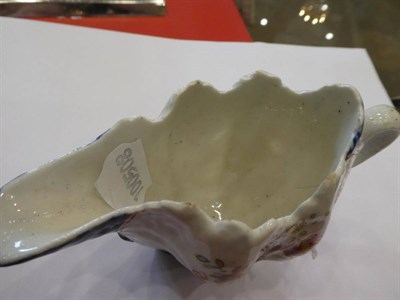 Lot 422 - A West Pans Porcelain Cream Jug, circa 1765, of leaf moulded oval form, painted with flower...