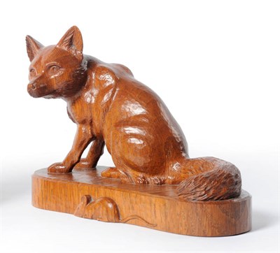 Lot 1750 - A Robert "Mouseman" Thompson Oak Fox, naturalistically carved in a seated stance on an oval...