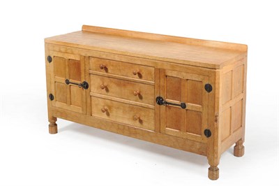 Lot 1756 - A Robert "Mouseman" Thompson Oak 5' Sideboard, with raised upstand, the moulded top over three long