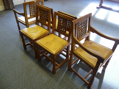 Lot 1758 - A Set of Six (4+2) Robert "Mouseman" Thompson Oak Lattice-Back Dining Chairs, with cow hide...