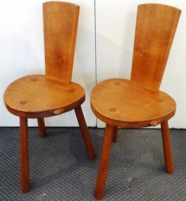 Lot 1764 - A Pair of Robert "Mouseman" Thompson Oak Backed Stools, with shaped rectangular backs, shaped...