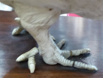 Lot 624 - A Japanese Ivory Model of a Chicken, Meiji period, naturalistically modelled standing on a hardwood