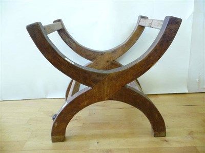 Lot 1769 - A Robert "Mouseman" Thompson Oak Cross-Framed Stool, with two Cross framed legs joined by four side