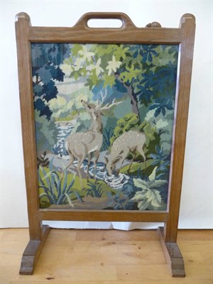 Lot 1773 - A Robert "Mouseman" Thompson Oak Fire-Screen, inset with a deer tapestry, on two sledge feet,...