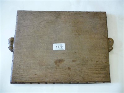 Lot 1779 - A Robert 'Mouseman' Thompson Oak Cheese Board, of rectangular design with castellated edge,...