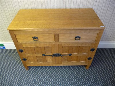 Lot 1784 - An Old Mill "The Knight Family" Oak Sideboard, with adzed top, over two short drawers and two...