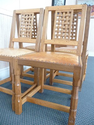 Lot 1786 - A Set of Four Old Mill "The Knight Family" Oak Lattice Back Dining Chairs, on two octagonal...