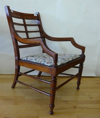 Lot 1788 - An Aesthetic Movement Walnut Low Armchair, with horizontal and vertical bar back, on turned...