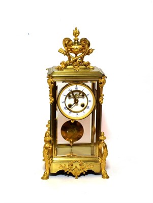 Lot 1505 - A Gilt Brass Four Glass Striking Mantel Clock, circa 1890, urn finial, scroll mounts, hoof...