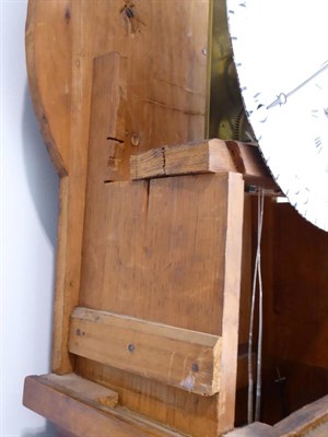 Lot 1520 - ~ A Burr Walnut Domestic Longcase Regulator, 19th century, drumhead carved pediment, trunk with...
