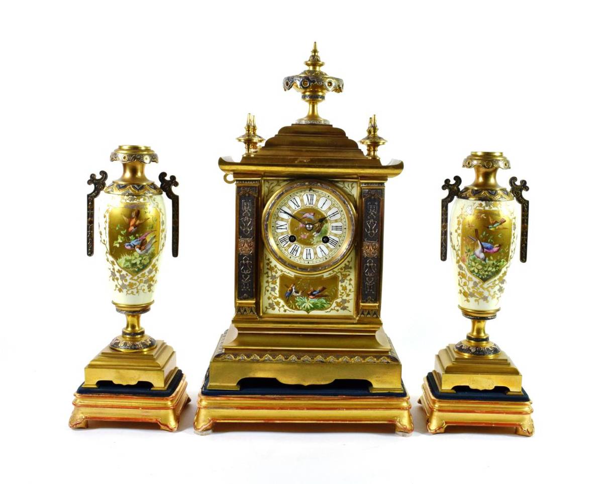 Lot 1529 - An Aesthetic Movement Gilt Metal Porcelain Mounted Striking Mantel Clock with Garniture, circa...