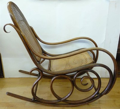 Lot 1792 - A Bentwood Rocking Chair, probably Thonet, bent solid beech frame with woven cane seat and...