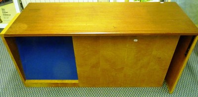 Lot 1796 - A 1960's Teak and Satinwood Desk, retailers label "George Churchill 11 Inn Yard, Tottenham...