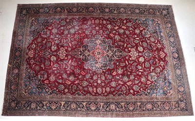 Lot 1584 - Kashan Carpet Central Iran, circa 1940 The raspberry field of scrolling vines around a central pole