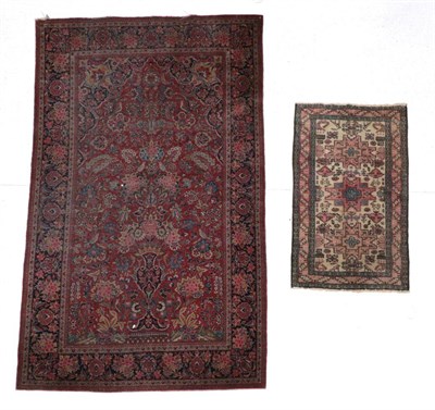 Lot 1587 - Kashan Prayer Rug Central Iran, circa 1930 The madder field with an urn issuing flowers beneath the