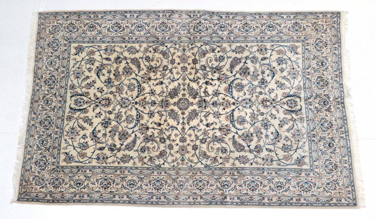 Lot 1591 - Nain Carpet Central Iran, circa 1970 The cream field with an allover design of scrolling vines...