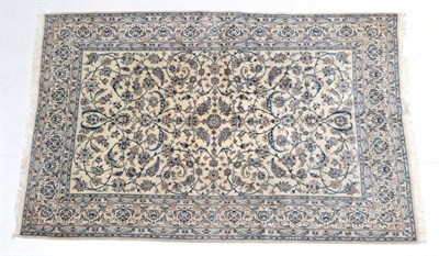Lot 1591 - Nain Carpet Central Iran, circa 1970 The cream field with an allover design of scrolling vines...