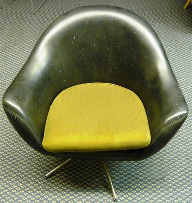 Lot 1797 - A 1960's Black Leather Swivel Chair, with shaped back, on a chrome base with black feet,...