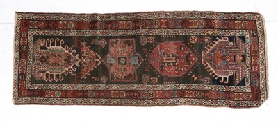Lot 1599 - Karajah Runner  North West Iran, circa 1890 The charcoal field of zoomorphic motifs and a column of
