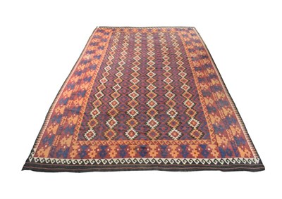 Lot 1609 - Large Maimana Kilim North West Afghanistan, circa 1970 The raspberry field with columns of...
