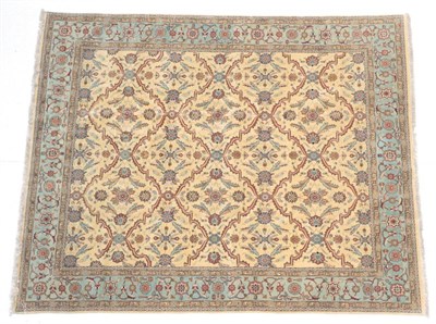 Lot 1610 - Indian Carpet, modern The cream field of scrolled lattice design containing leaves and flowers...