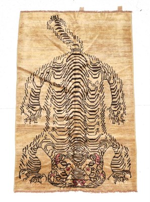 Lot 1614 - Tiger Rug Nepal/Tibet, modern The pale mushroom field with semi-naturalistic tiger, 190cm by 120cm