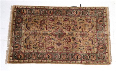 Lot 1620 - Modern Indian Ziegler Design Rug The mustard field of cloud band and vines around the medallion...