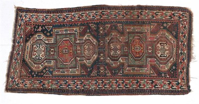 Lot 1621 - Kazak Rug Central Caucasus, circa 1890 The indigo field with a row of linked güls enclosed by...