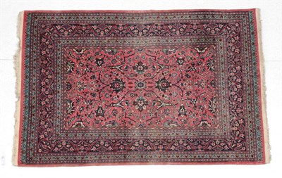 Lot 1622 - Kashmir Rug North West India, circa 1930 The coral pink field with an allover design of...