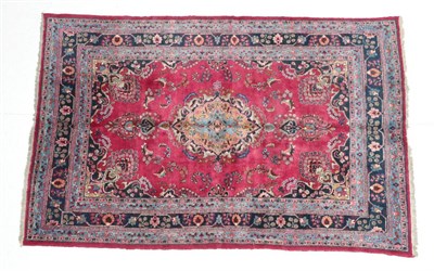 Lot 1624 - Mashad Carpet North East Iran, circa 1920 The raspberry field with central medallion framed by...
