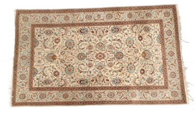 Lot 1629 - Kashan Rug Central Iran, circa 1940 The cream field with an allover design of palmettes and...