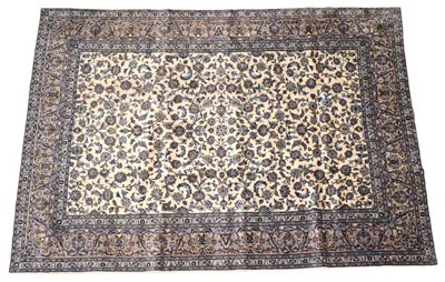 Lot 1633 - Kashan Carpet Central Iran, circa 1960 The ivory field with an all over design of scrolling...
