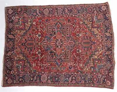 Lot 1637 - Heriz Carpet of unusual size Iranian Azerbaijan, circa 1920 The madder field of angular vines...