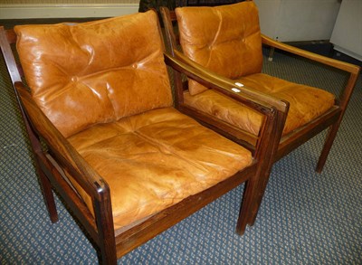 Lot 1802 - A Pair of 1960's Danish Rosewood Elbow Chairs, with slatted horizontal backs, loose brown...