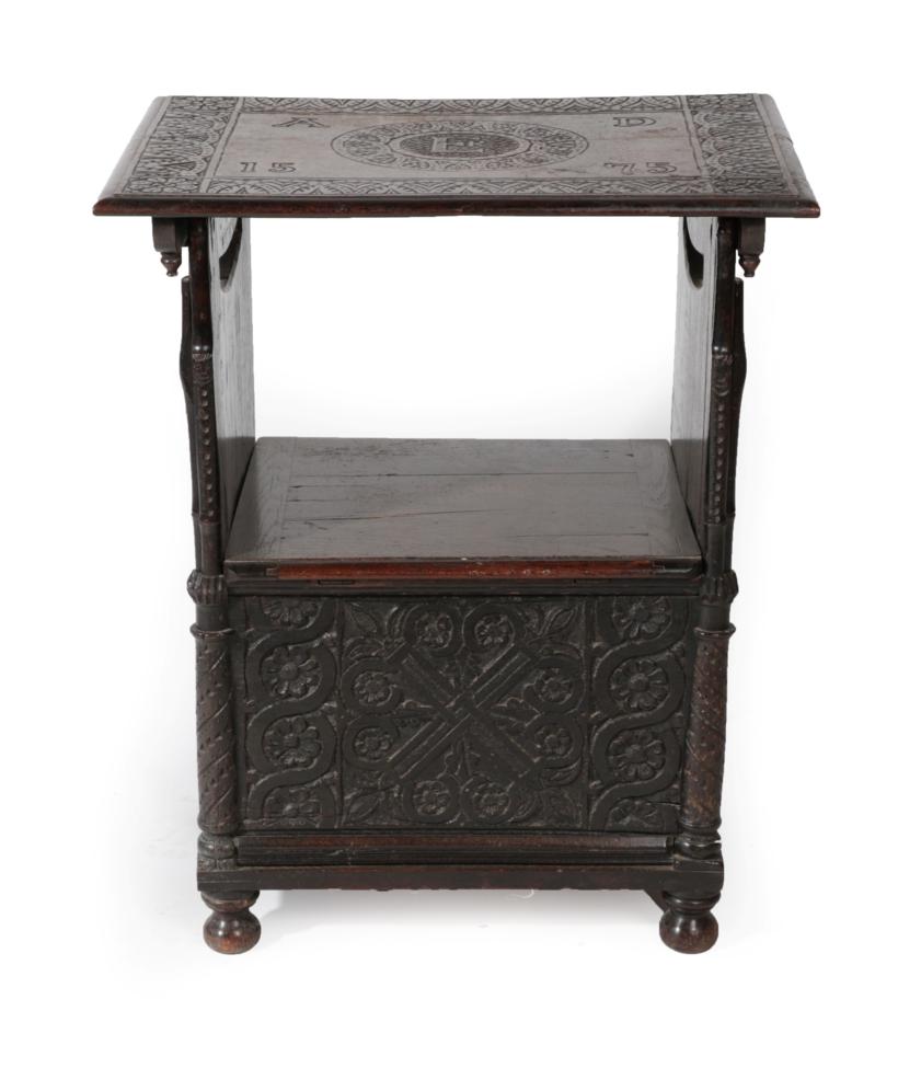 Lot 1645 - A Carved Oak Monk's Chair, bearing date 1575 and initials AD, the pivoting top with a carved border