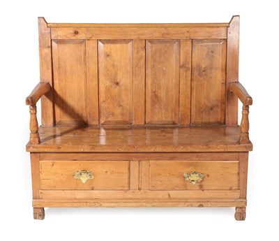 Lot 1649 - A Pine Settle, the back support with four moulded panels above spindle turned arm supports, the...