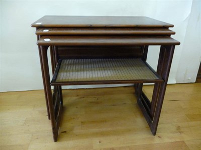 Lot 1803 - A Danish Rosewood Nest of Tables, the smallest with lower wicker woven undertier, labelled Made...