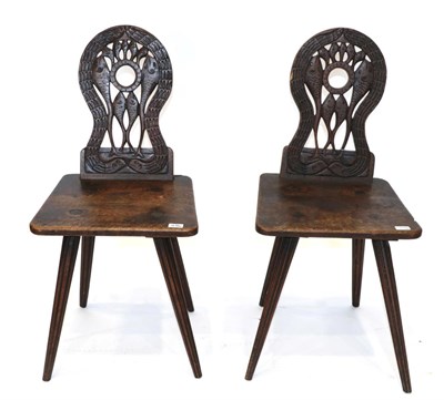 Lot 1656 - A Pair of 18th Century Walnut or Fruitwood Side Chairs, of unusual form, the carved back support in