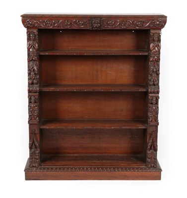 Lot 1661 - A Victorian Carved Oak Dwarf Bookcase, late 19th century, the top section with a stiff leaf...