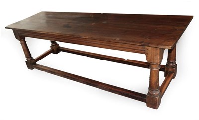 Lot 1665 - An Oak Refectory Dining Table, in 17th century style, the three plank top above a moulded...