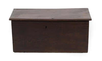 Lot 1668 - An Early 18th Century Boarded Oak Chest, the hinged lid with moulded edge enclosing a hinged candle