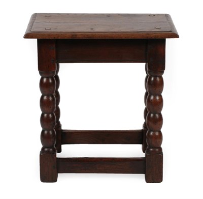 Lot 1669 - An 18th Century Oak Joint Stool, the four peg top with moulded edge above a plain apron on...