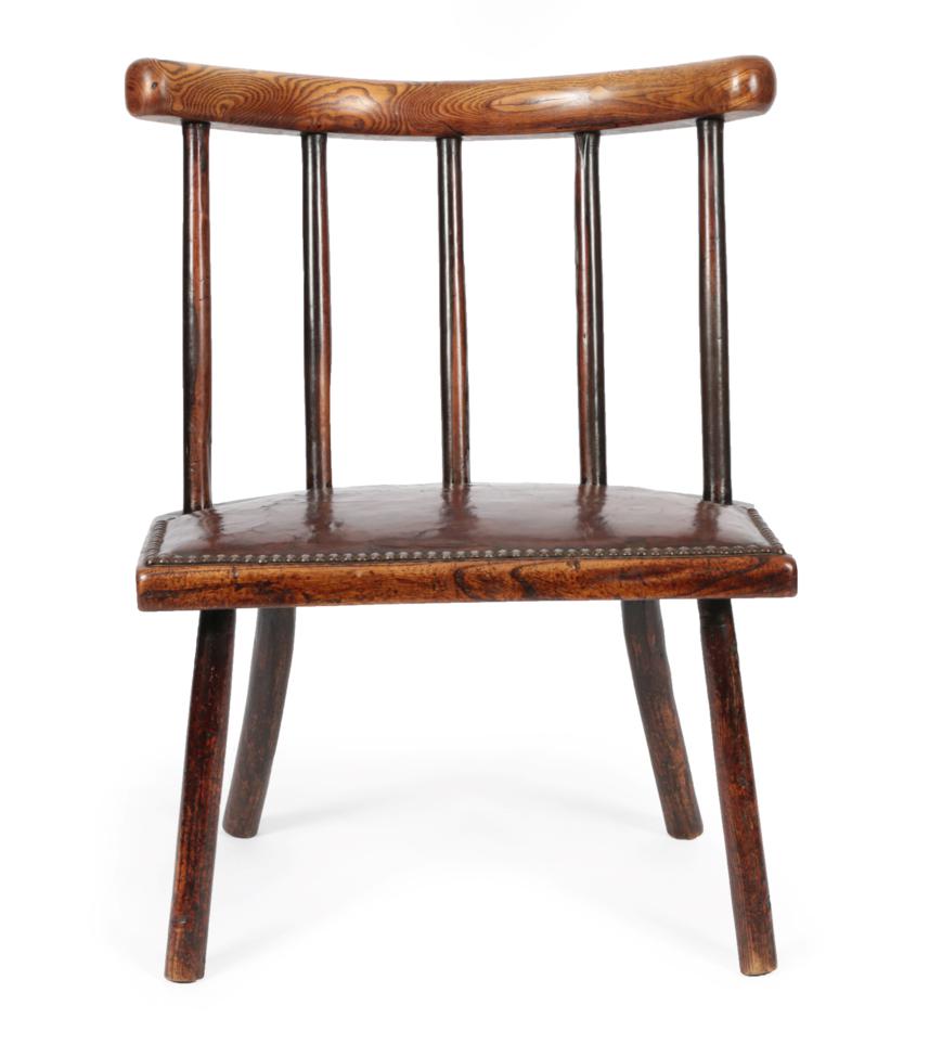 Lot 1670 - An Early 19th Century Child's Ash and Fruitwood Spindle Back Chair, the curved top rail above a...