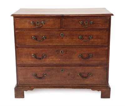 Lot 1671 - A George III Oak Straight Front Chest of Drawers, late 18th century, the moulded top above two...