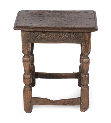 Lot 1681 - A 17th Century Oak Joint Stool, the pegged top above a lunette carved frieze, on baluster...