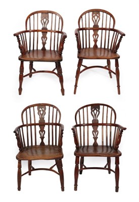 Lot 1687 - A Matched Set of Four Mid 19th Century Yew and Elm Windsor Armchairs, with double pierced...