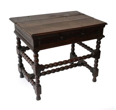 Lot 1692 - A Late 17th Century Oak Side Table, with long frieze drawer, on bobbin and block legs joined by...