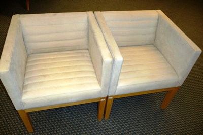 Lot 1807 - A Pair of David Linley Dice Carver Chairs, upholstered in ivory leather, on four sycamore...