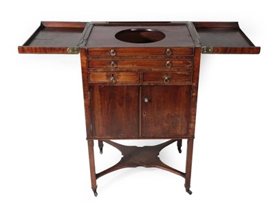 Lot 1705 - A George III Mahogany Washstand, late 18th century, the brass bound hinged lid enclosing a circular